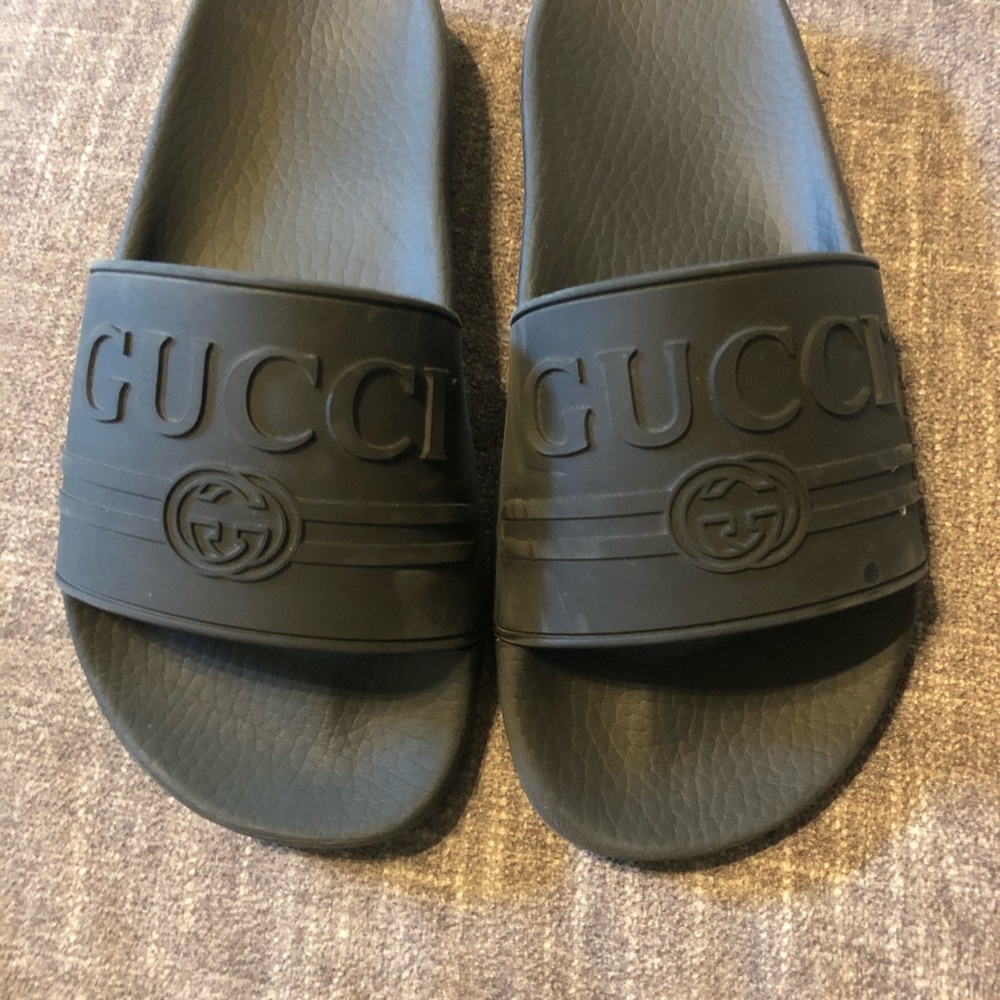 Black rubber Gucci slides size 36. Some scuffs.